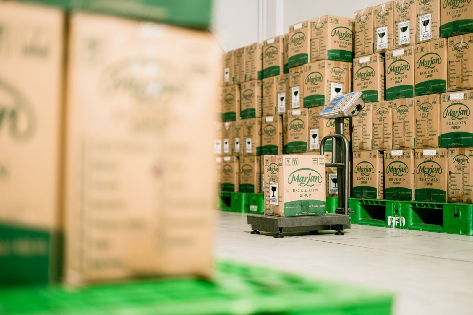 A carton being weighed on a floor scale